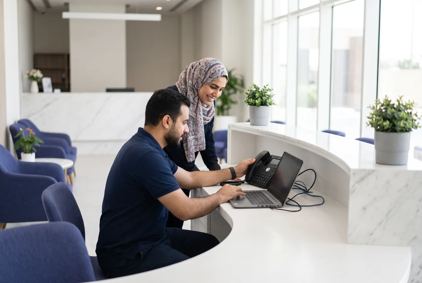 An IT integrator setting up HeyServo at a clinic reception